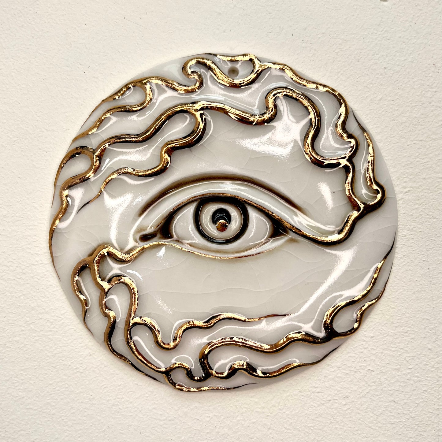 Tear Drop Wall Ornament 1 - Hand crafted Porcelain Home Ornament. Circular ornament with Eye and flames.