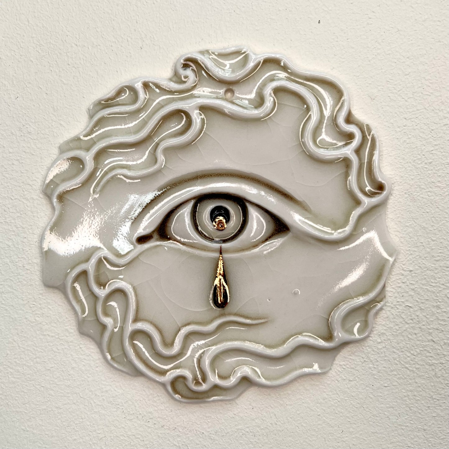 Tear Drop Wall Ornament 2 - Hand crafted Porcelain Home Ornament. Circular ornament with Crying Eye and flames.